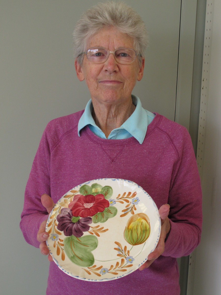 Joan holding plate
