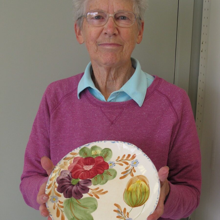 Joan holding plate